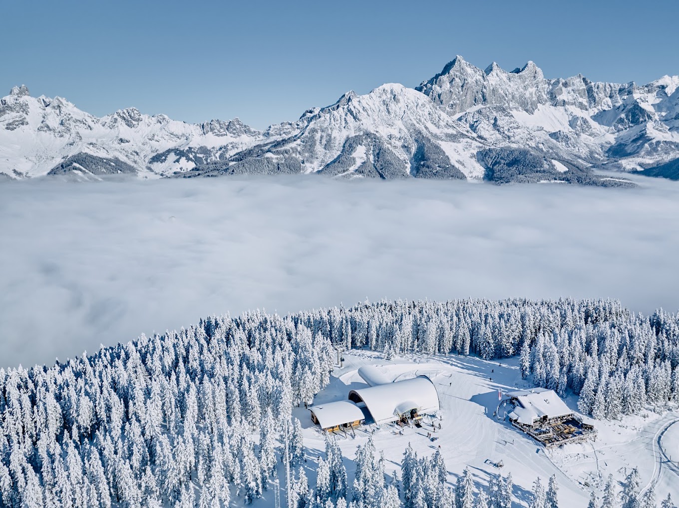 Filzmoos in Austria - a cabin in the mountains surrounded by snow covered trees.