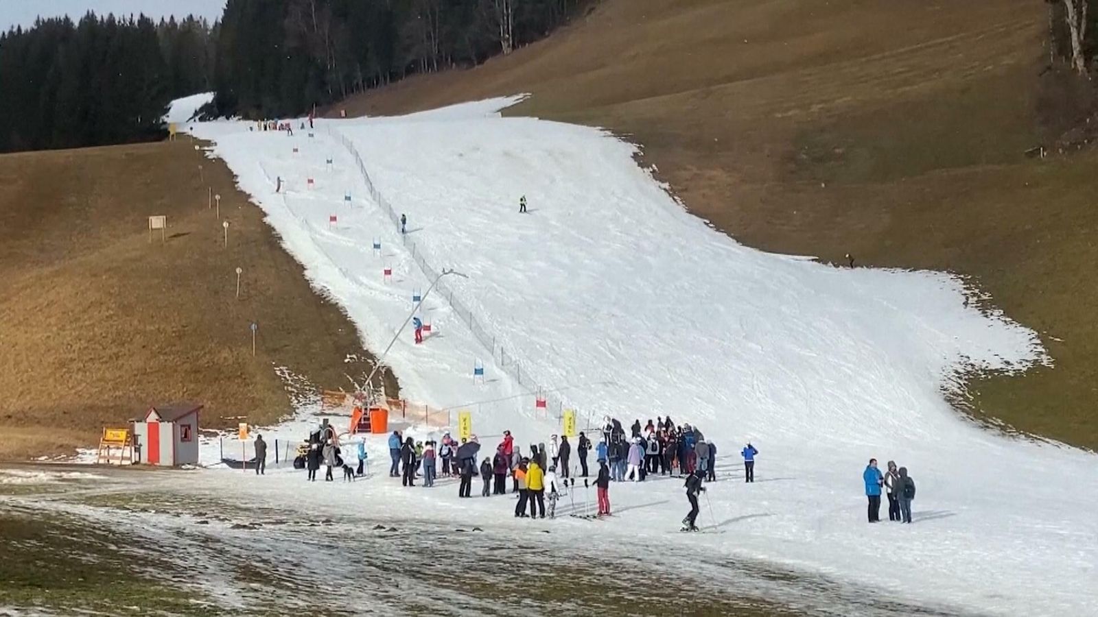Filzmoos in Austria - a group of people standing on top of a snowy hill.