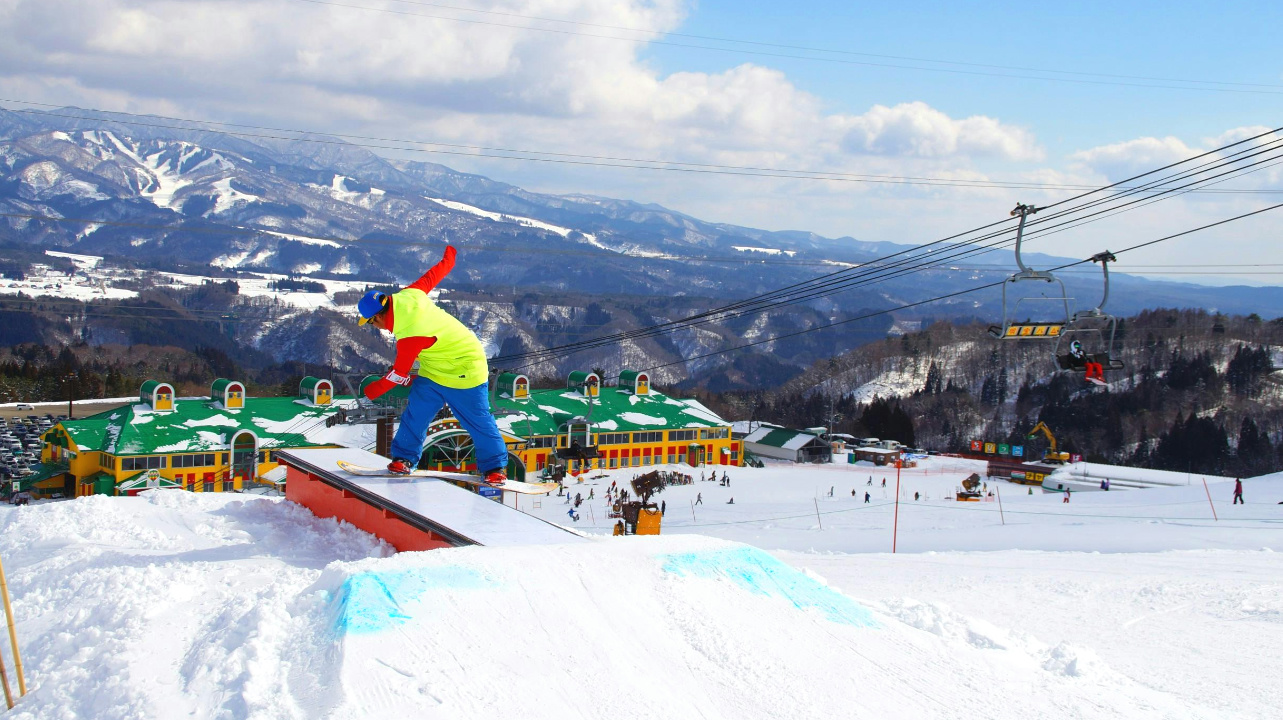 Takasu Snow Park in Japan - a person on a snowboard doing a trick.