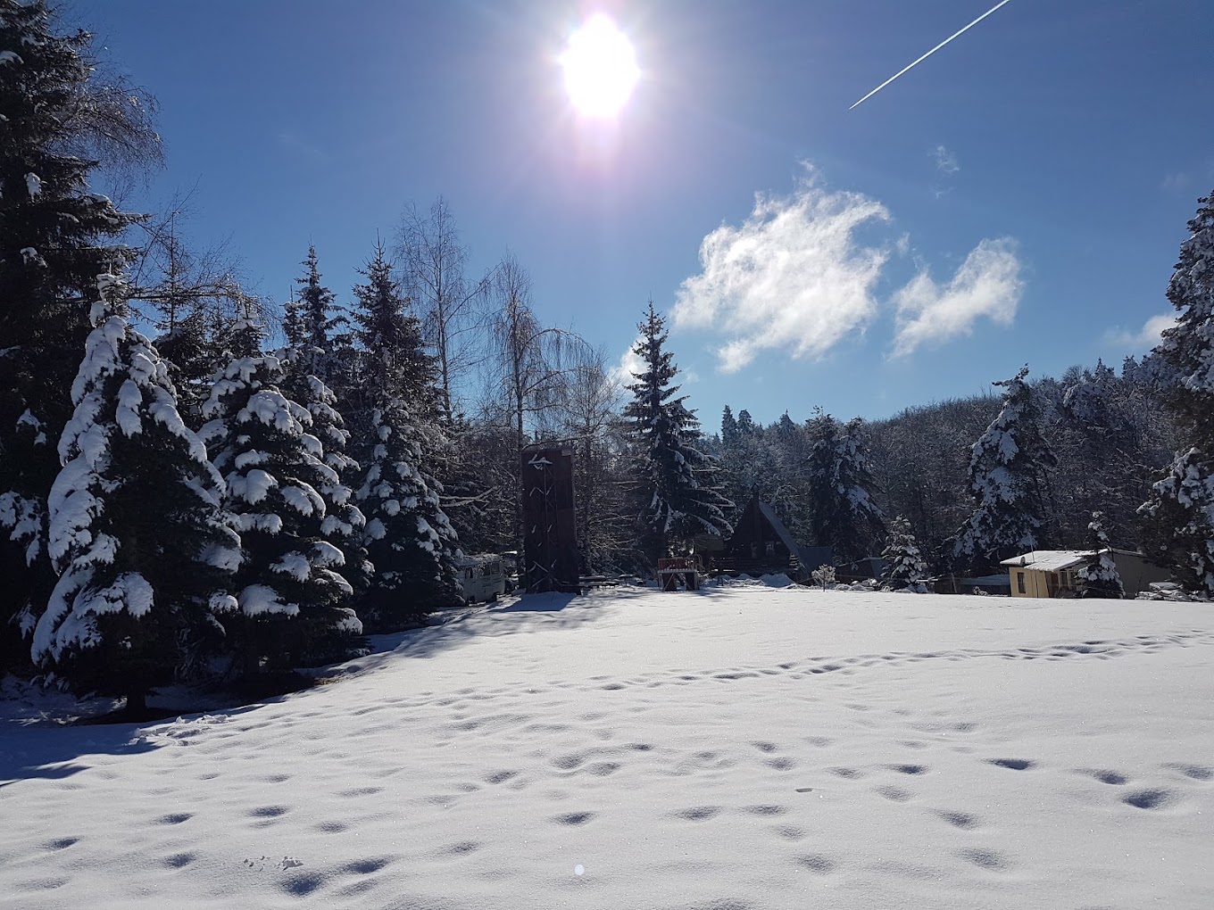 Sveti Konstantin in Bulgaria - a snow covered field with trees in the background.
