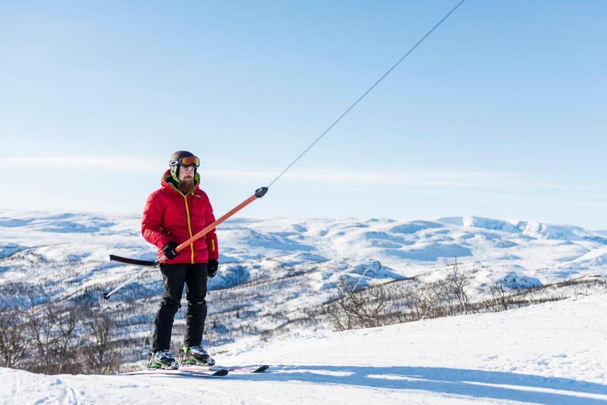 Skarslia in Norway - a woman on skis in the mountains.