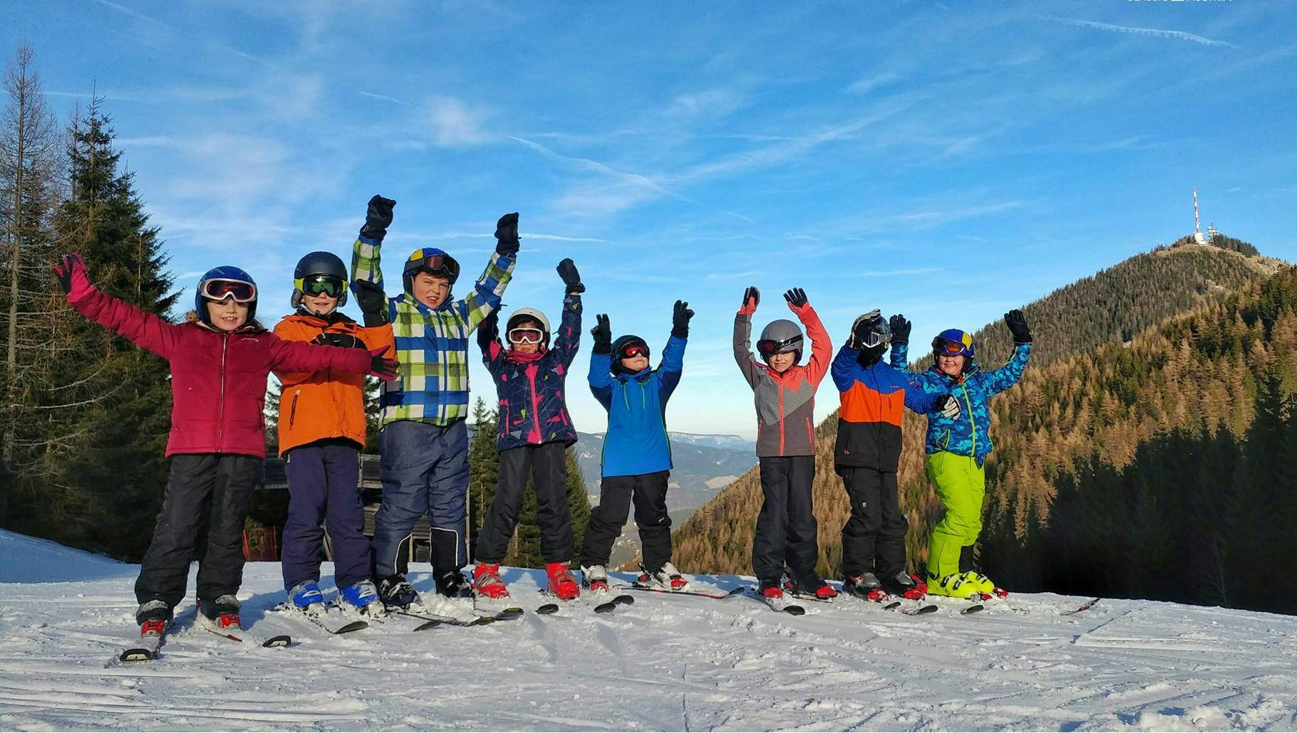 Zauberberg Semmering in Austria - a group of people standing on top of a snow covered mountain.