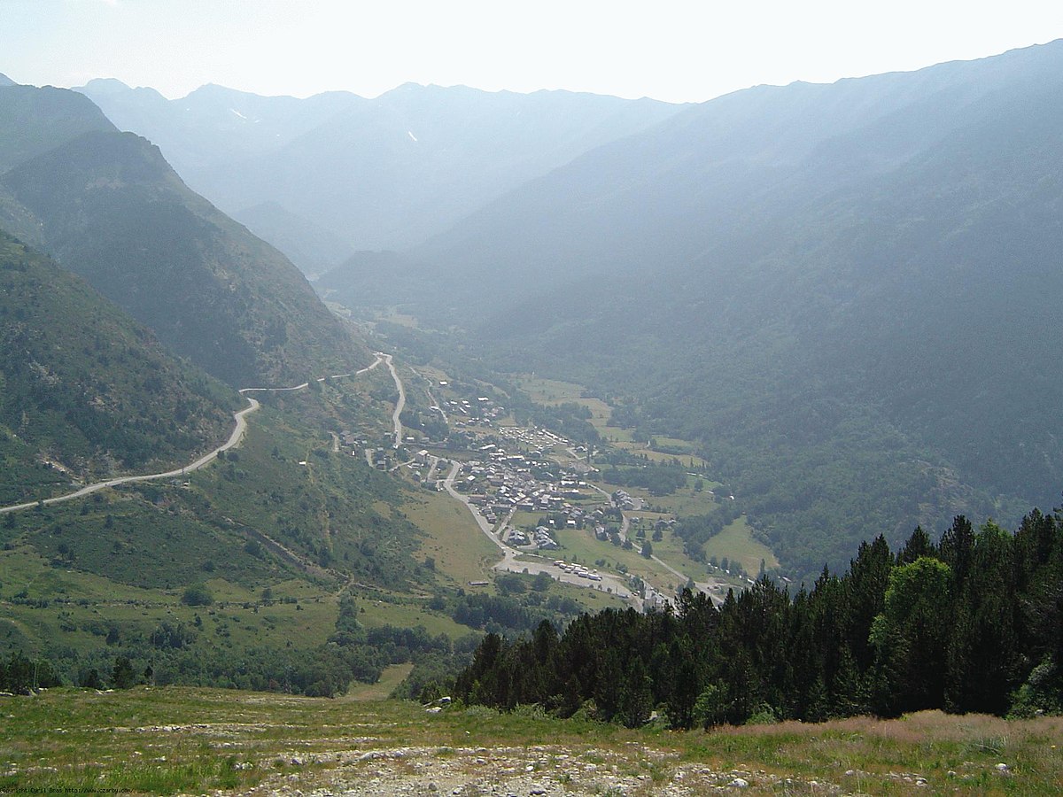 Porté Puymorens in France - a view of a valley with mountains in the background.