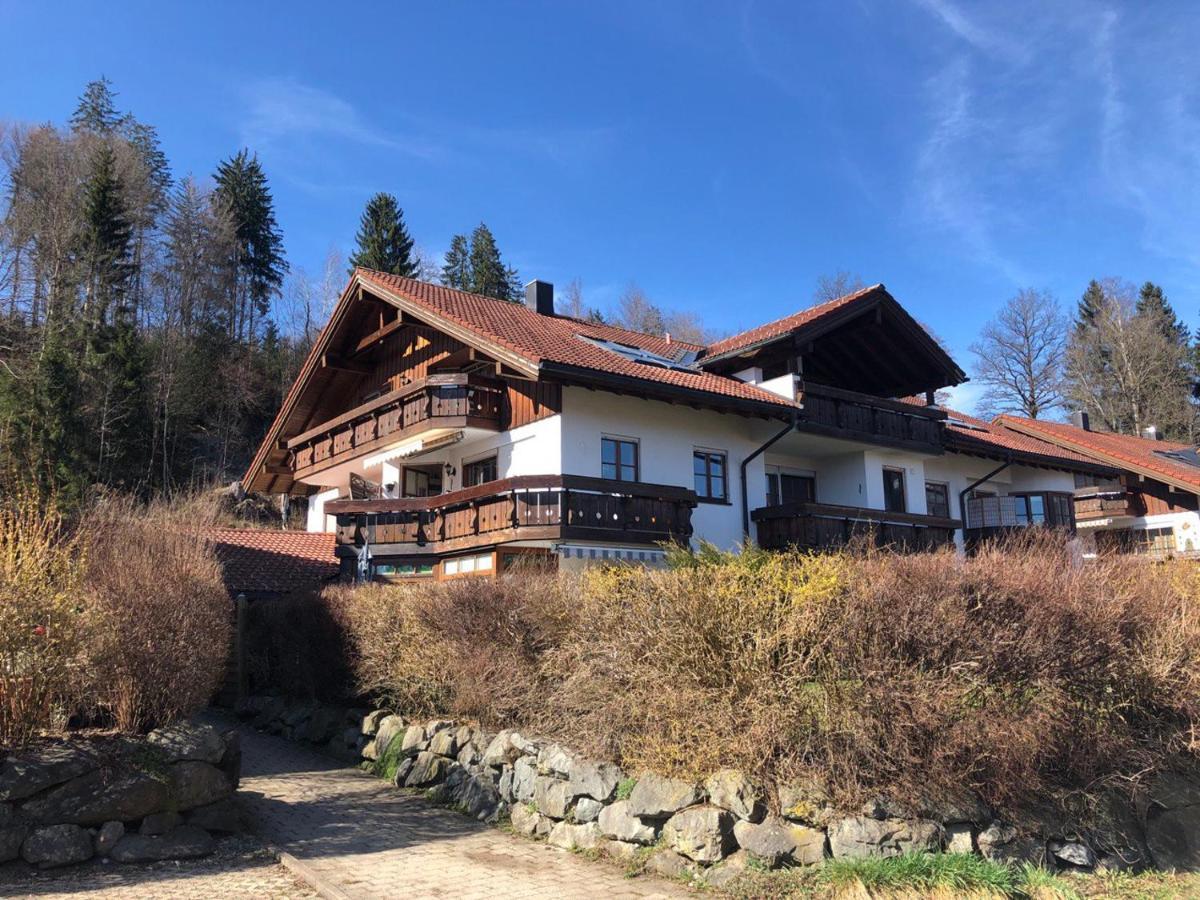 Bergbahnen Ofterschwang- Gunzesried GmbH & Co. KG in Germany - a house in the mountains, surrounded by trees.
