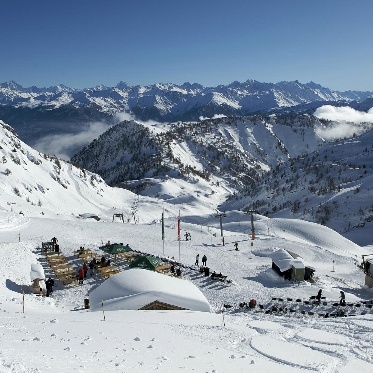 Ovronnaz in Switzerland - a group of people standing on top of a mountain.
