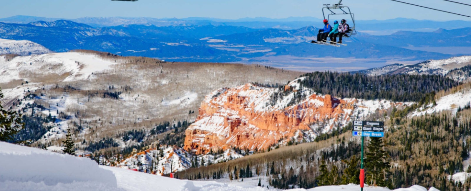 Brian Head in USA - a person on a ski lift going down the mountain.