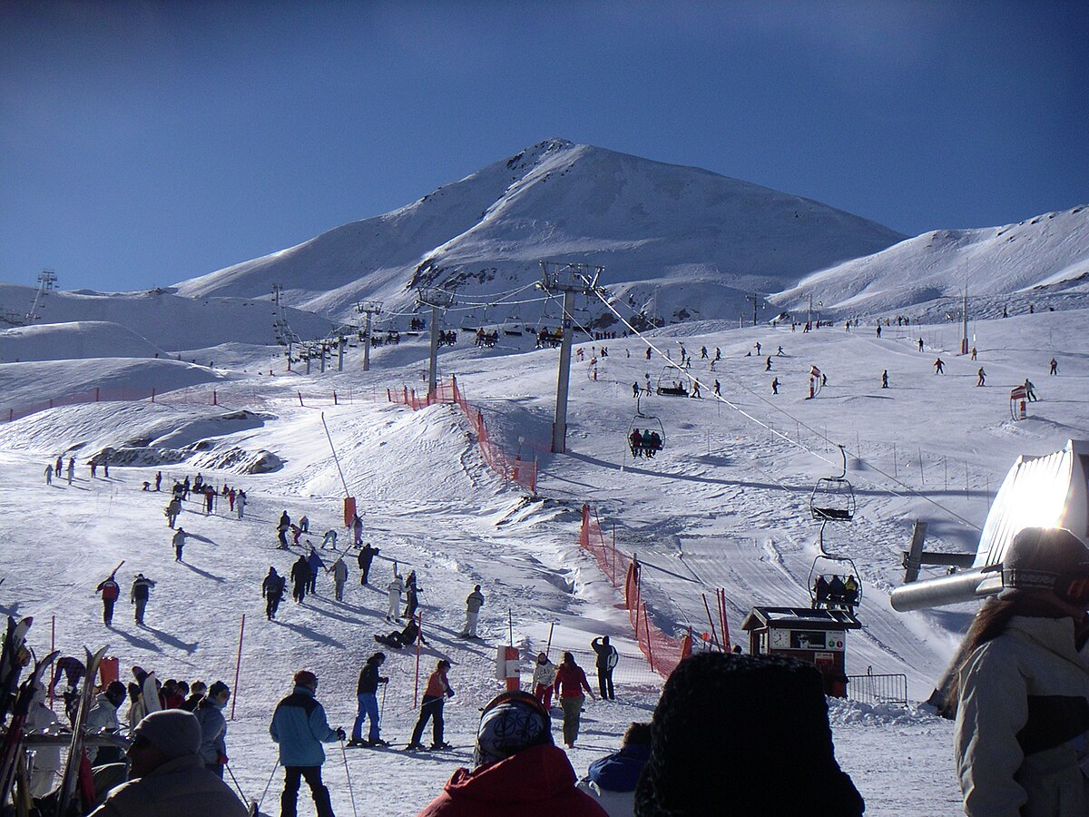 Boí Taüll in Spain - a group of people skiing down a snowy slope.