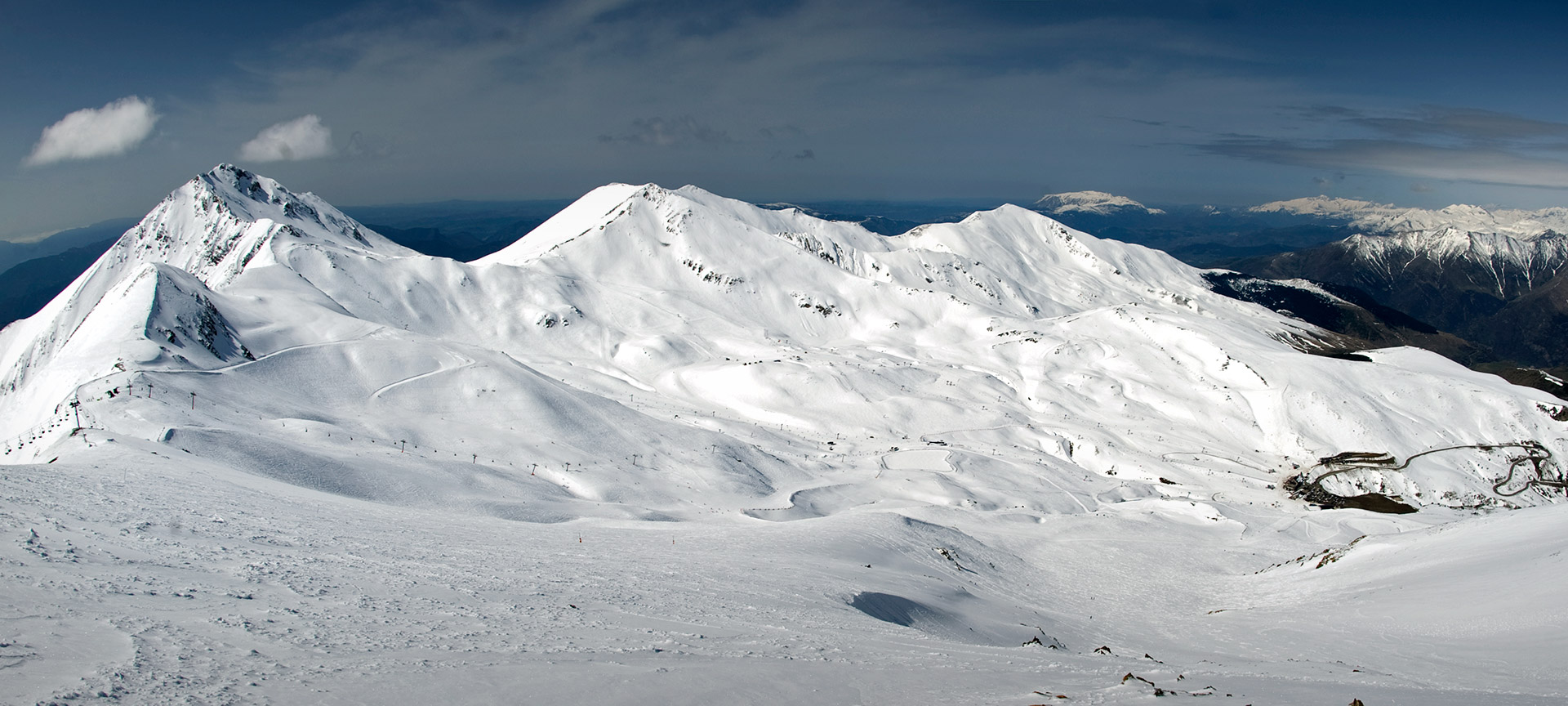 Boí Taüll in Spain - a snow covered mountain with some clouds in the sky.