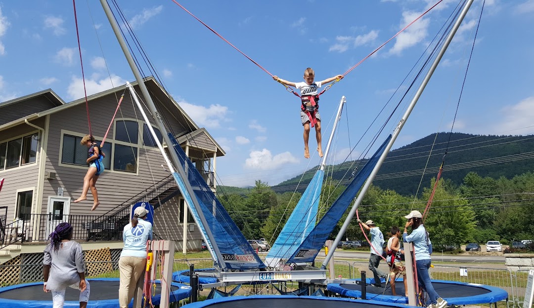 Attitash Mountain Resort in USA - a group of people on a trampoline