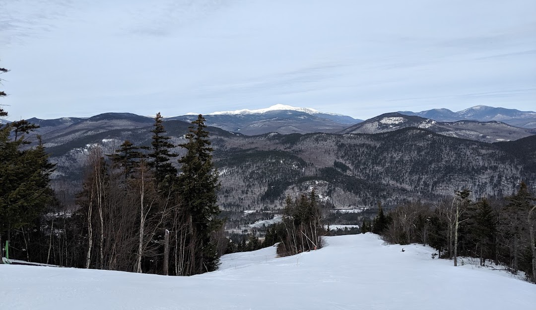 Attitash Mountain Resort in USA - a view of the mountains from the top of a hill.