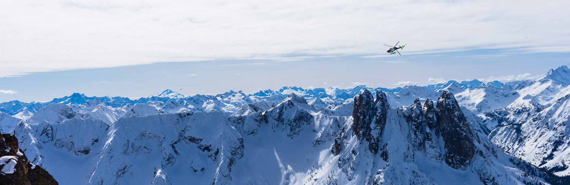 North Cascade Heliskiing – Mazama in USA - a person standing on top of a mountain.