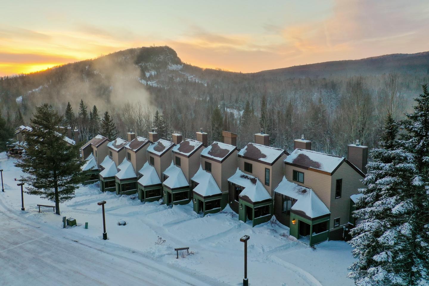 Lutsen Mountains in USA: a ski resort in the mountains at sunset.