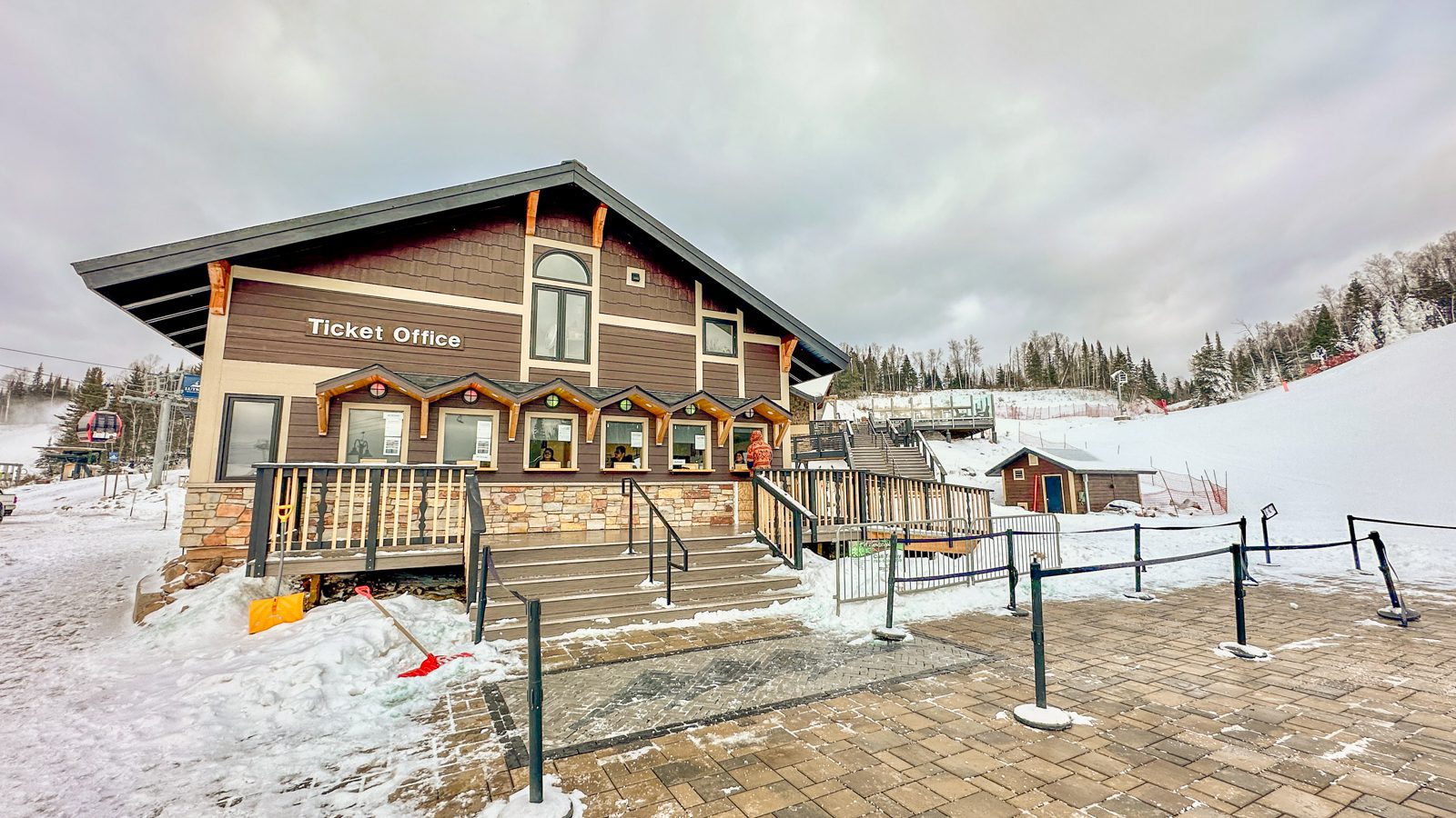 Lutsen Mountains in USA - a house with snow on the ground in front of it.