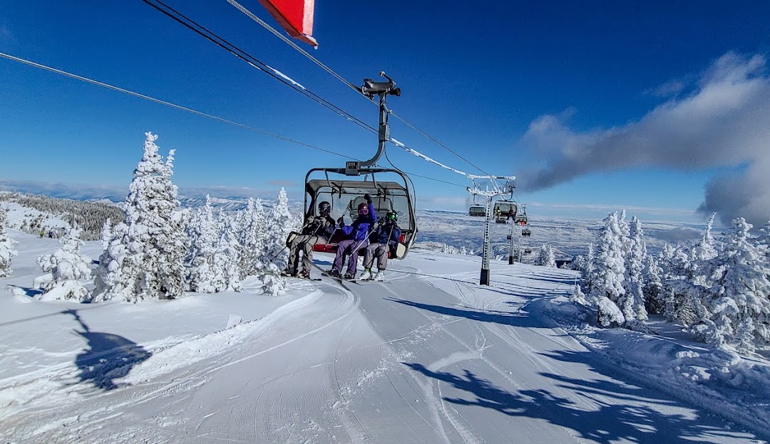 Mission Ridge WA in USA - a person on a ski lift going down the mountain.