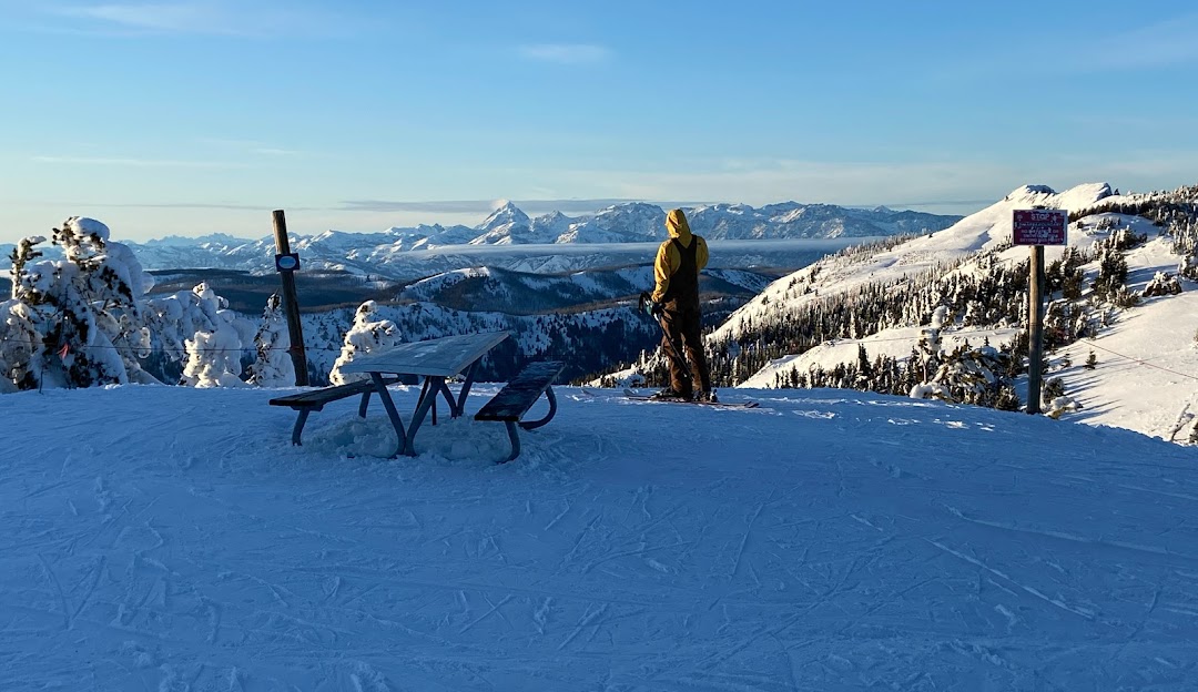 Mission Ridge WA in USA - a person standing on top of a snow covered mountain.