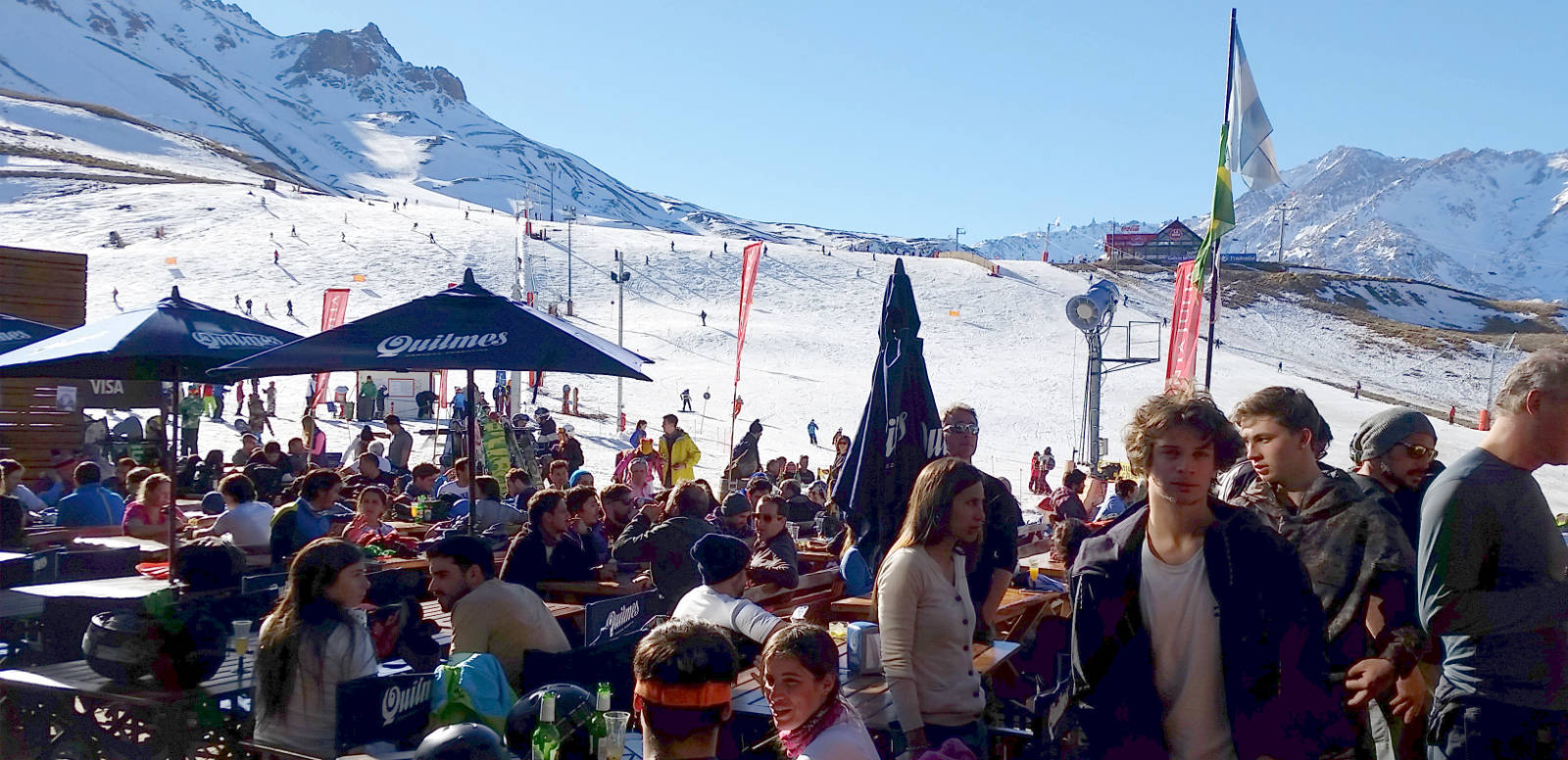 Las Leñas in Argentina - a crowd of people sitting at tables in the snow.