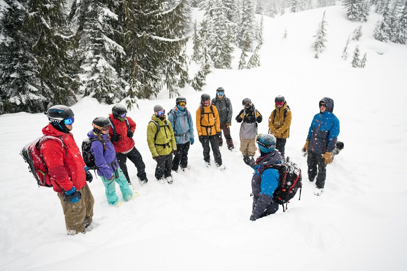 Cascade Powder Guides in USA - a group of people standing in the snow.