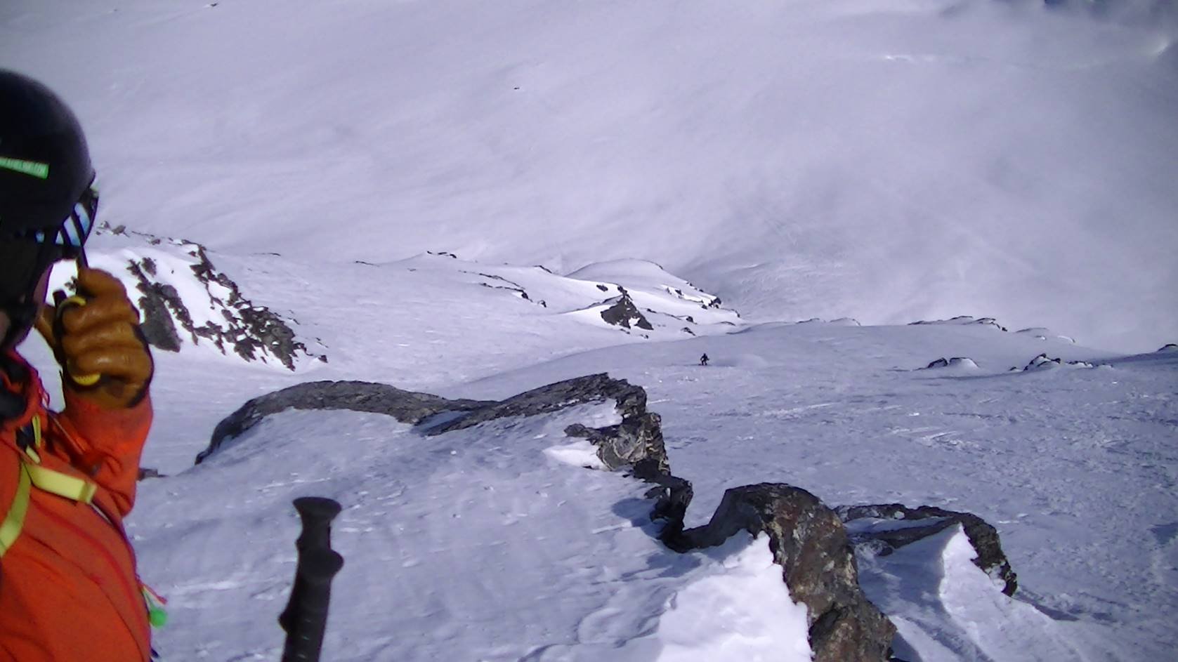 Cascade Powder Guides in USA - a person in a red jacket on a mountain.