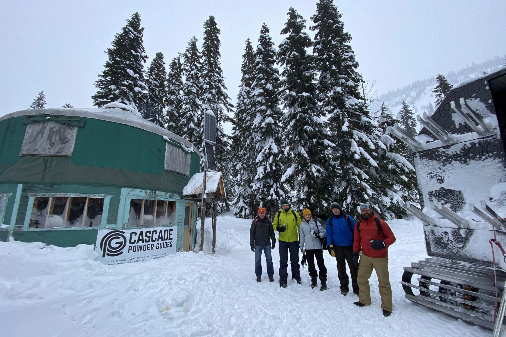 Cascade Powder Guides in USA - a group of people standing in the snow.