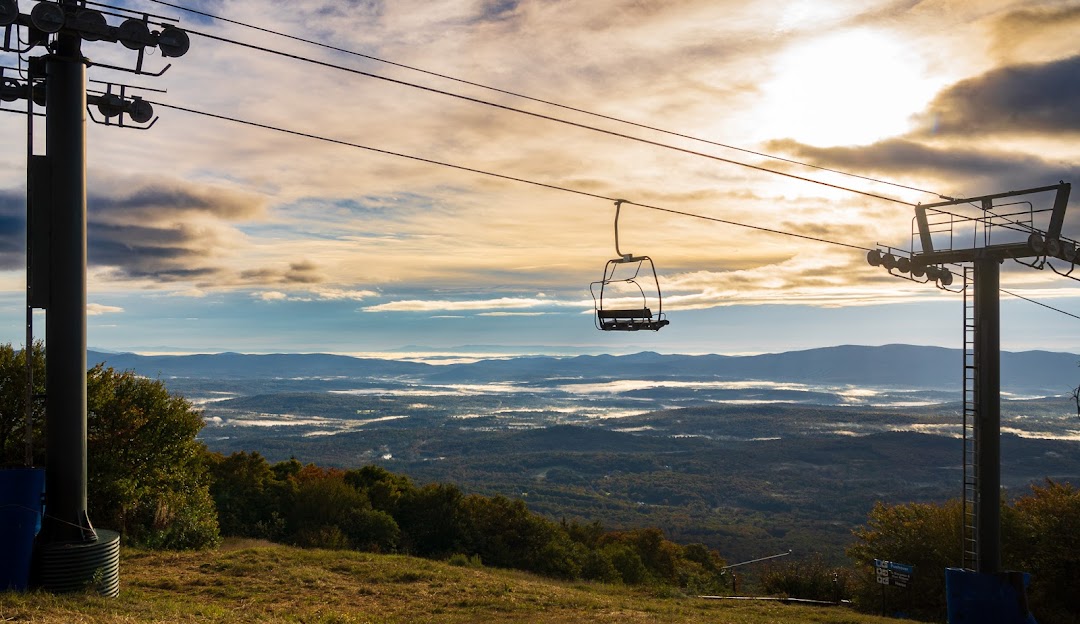 Bromley Mountain in USA - a ski lift going up a mountain at sunset.