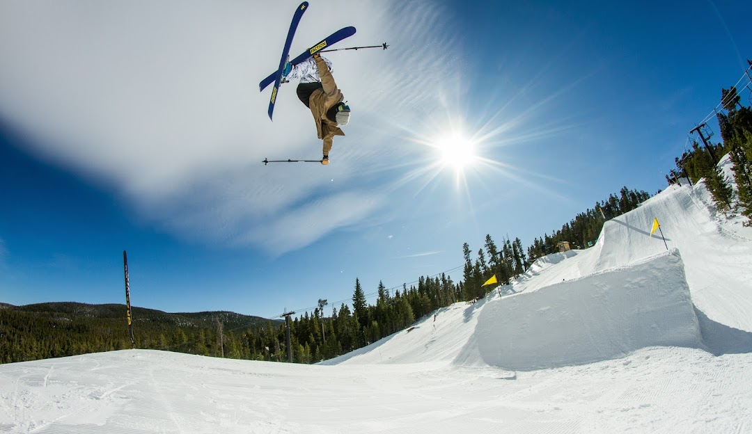 Eldora Mountain in USA - a man flying through the air while riding a snowboard.