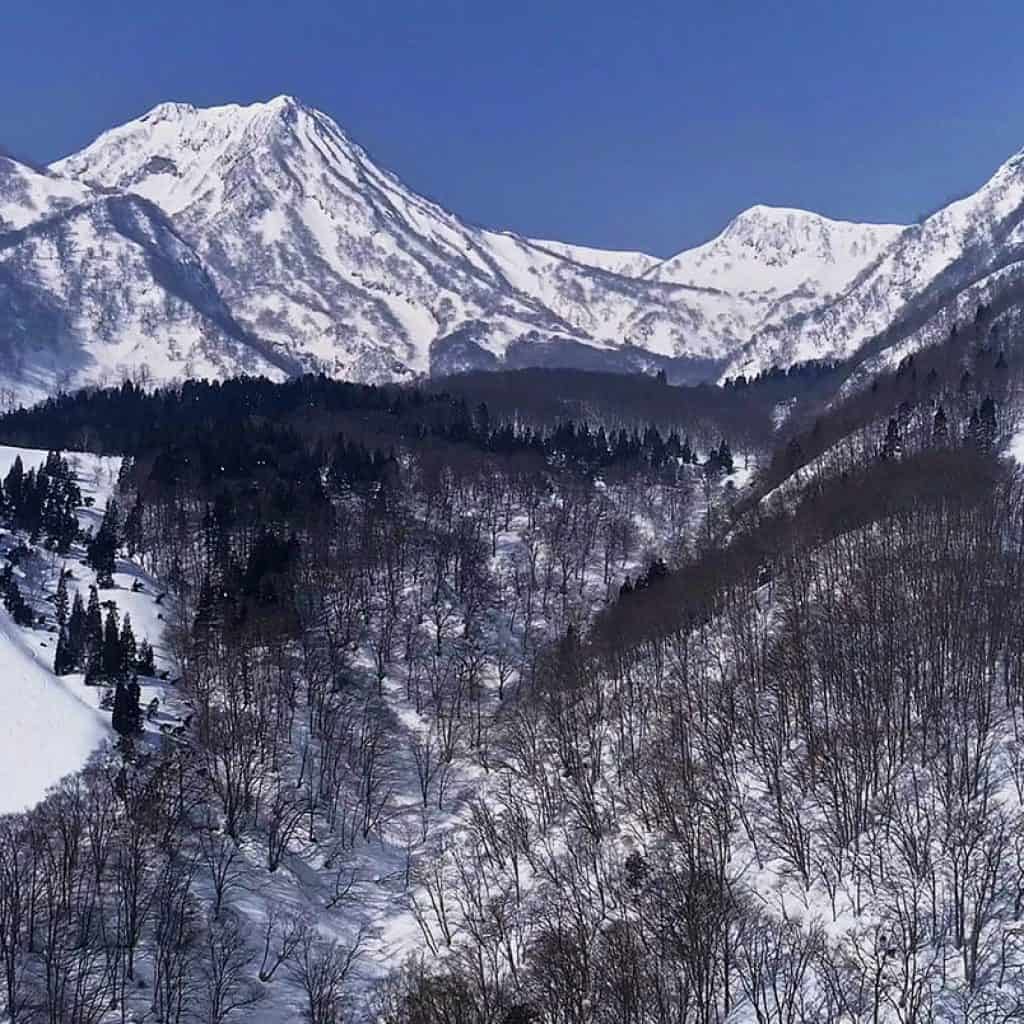 Seki Onsen in Japan - the mountains are covered in snow and trees.
