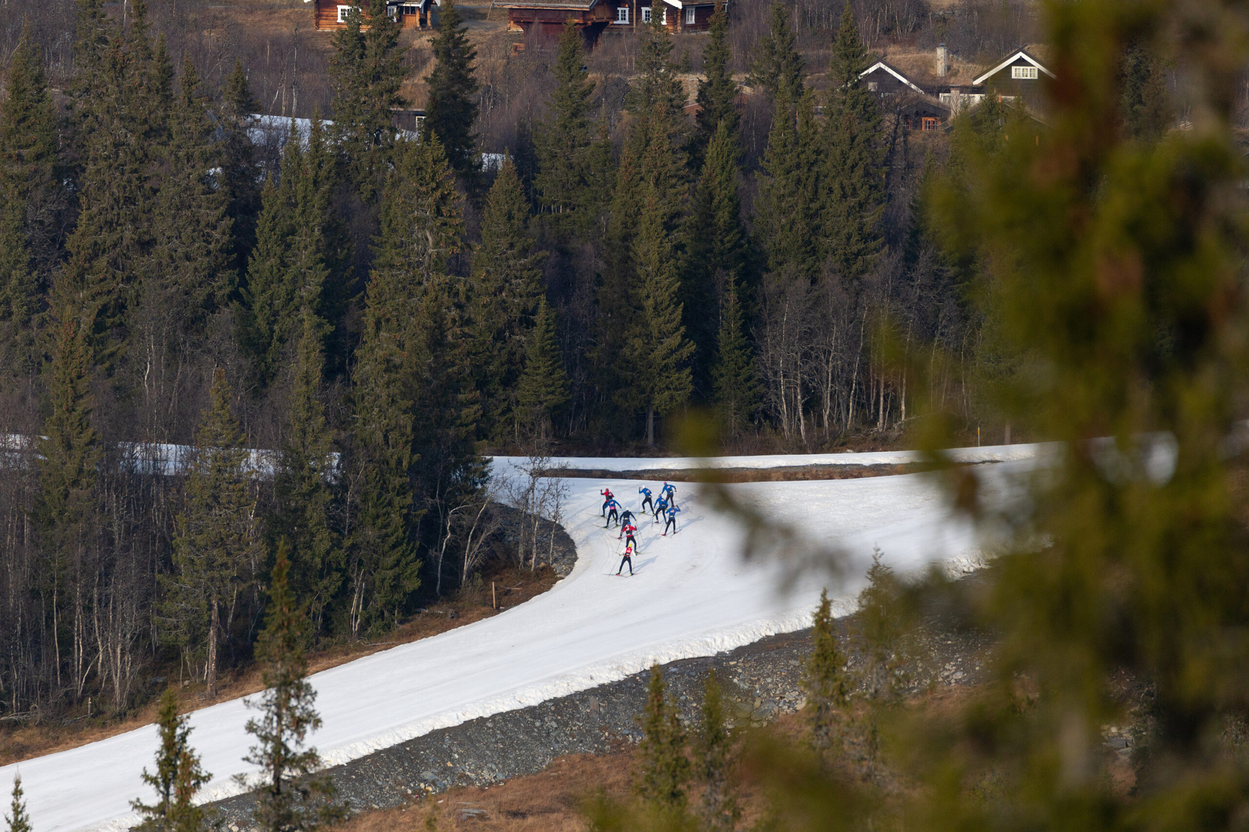 Winter sports enthusiasts enjoy a day at the Beitostølen ski resort in Valdres, Oppland, Norway, featuring a bustling ski lift and skiers in the snow-clad landscape.