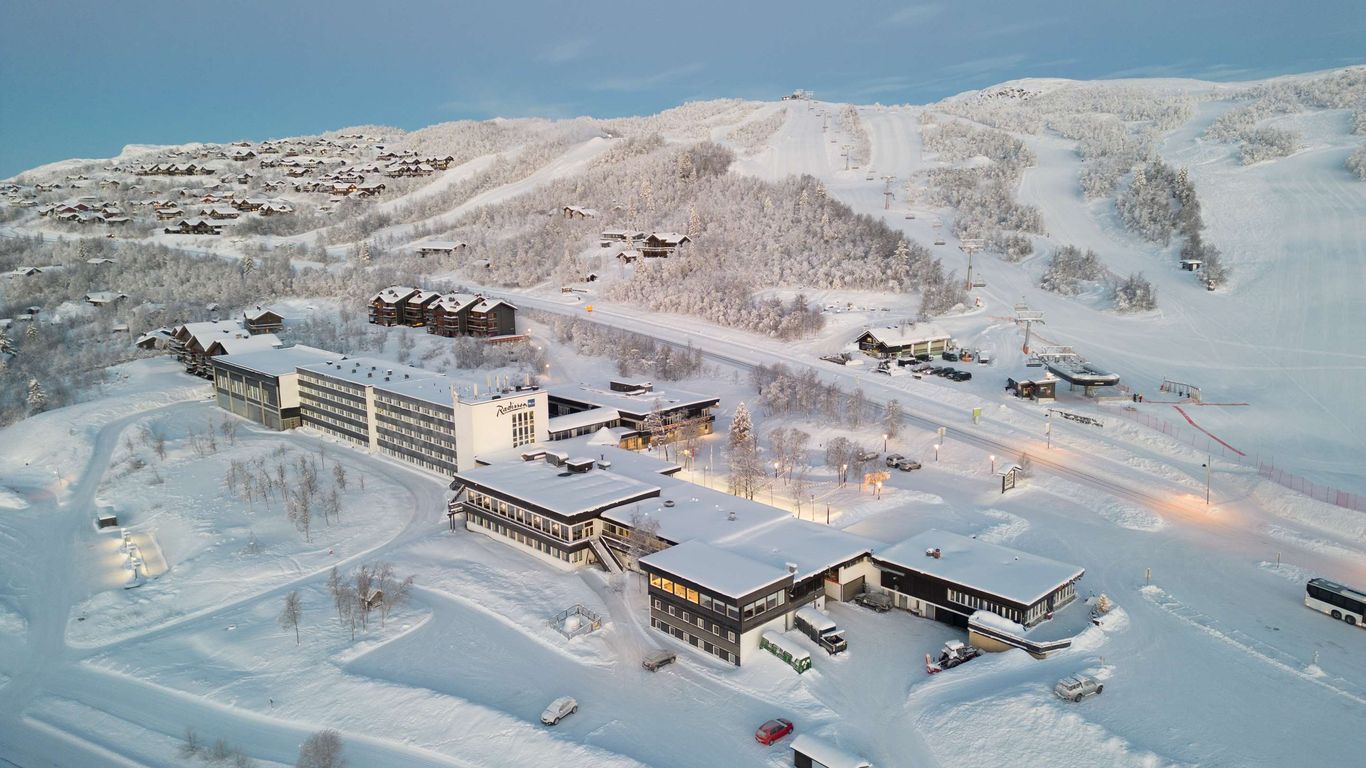 Beitostølen in Norway: a ski resort surrounded by snow covered mountains.
