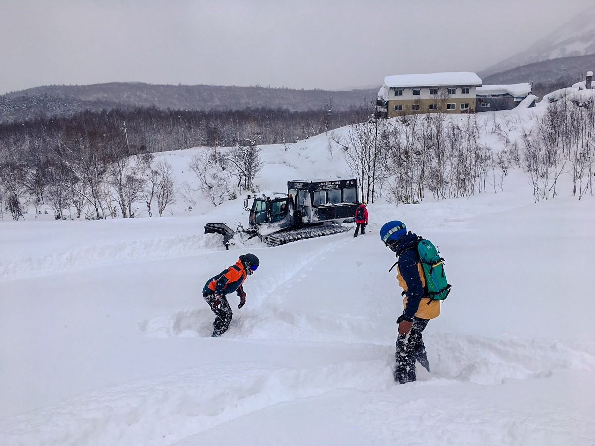 Niseko Weiss Cat in Japan - a couple of people that are in the snow.
