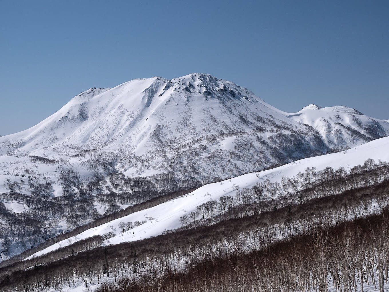 Stunning view of the snow-covered mountains at Niseko Weiss Cat in Kutchan Hokkaido Japan perfect for winter sports.