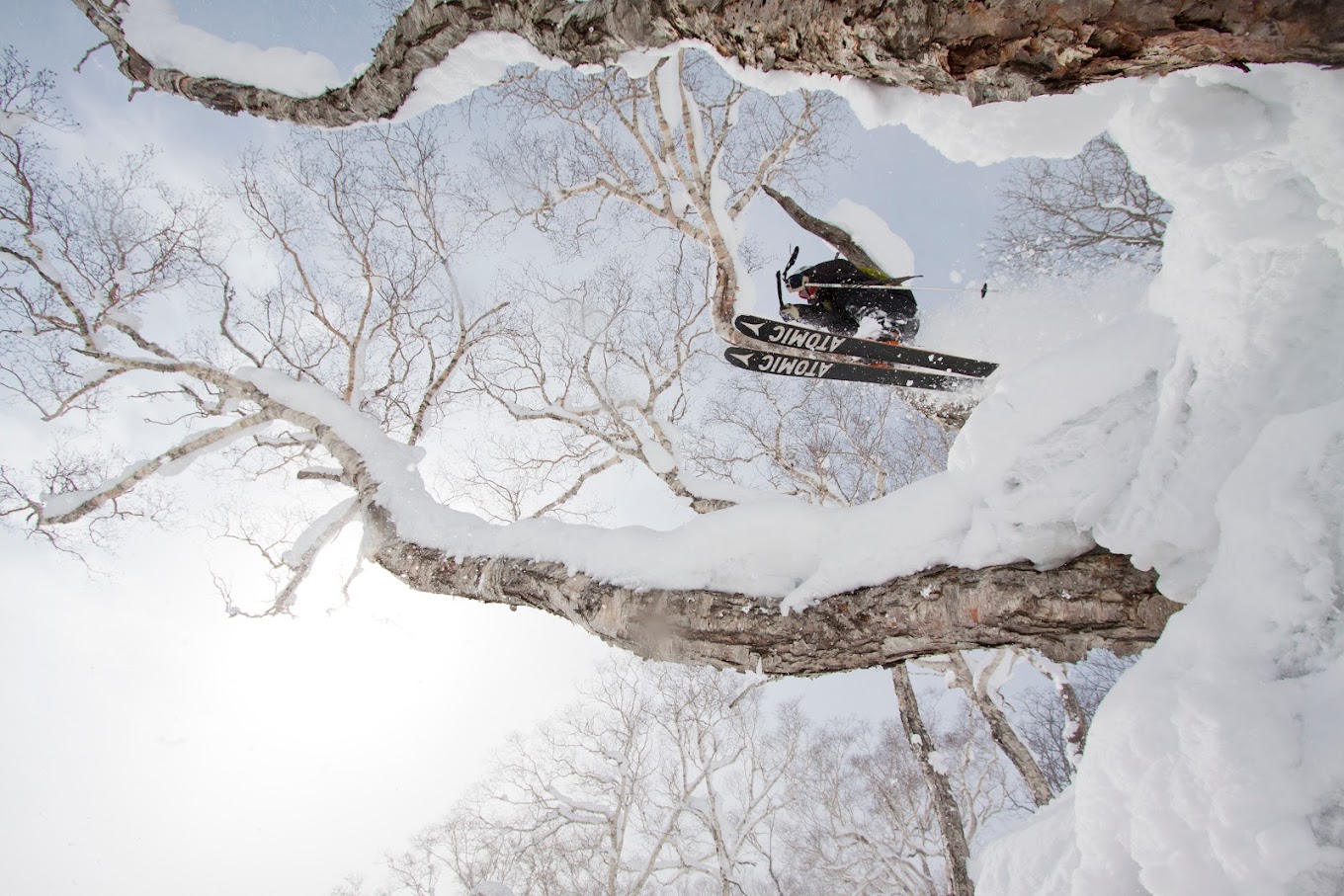 A snowboarder enjoying a thrilling ride down the pristine, snow-covered slopes of Niseko Weiss Cat in Kutchan, Abuta District of Hokkaido, Japan.