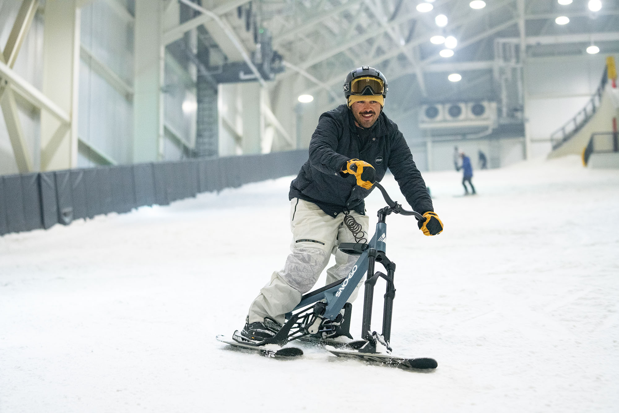 A snowboarder skillfully gliding down the snowy slopes at Big Snow American Dream in New Jersey, USA.