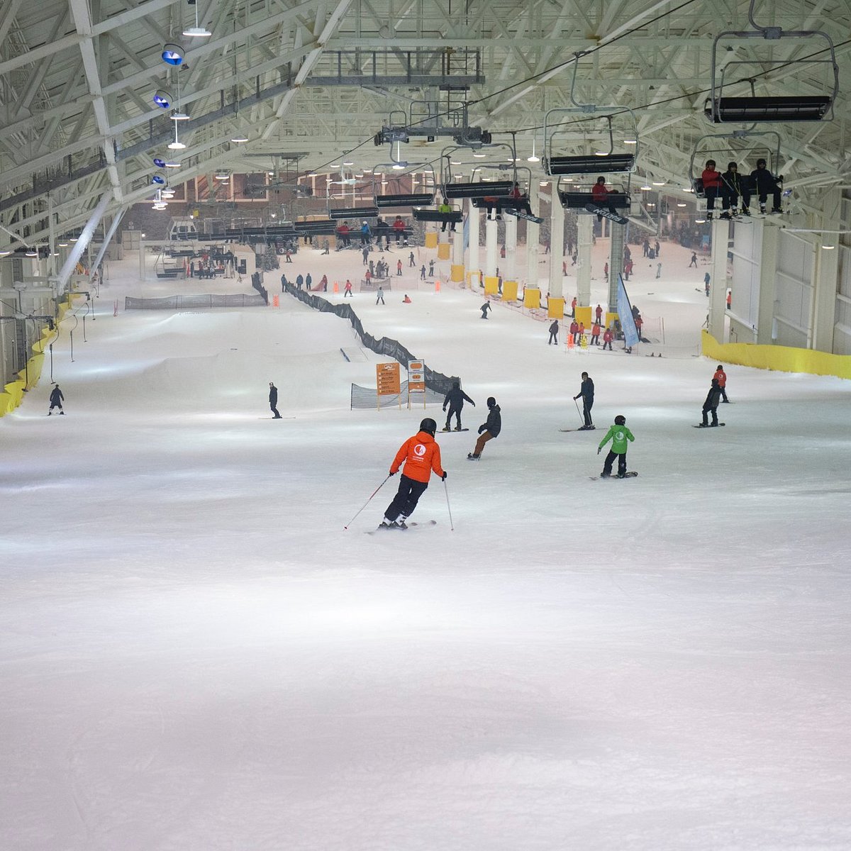 Big Snow American Dream in USA - a group of people riding ski boards down a slope.