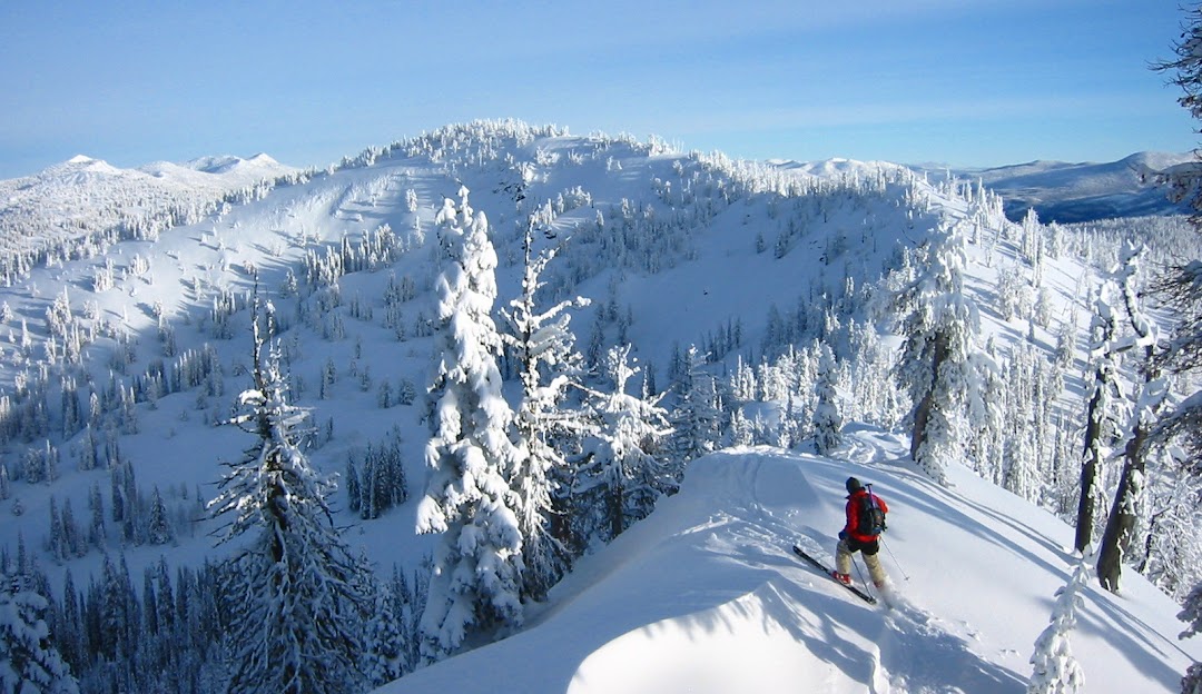 Brundage Mountain in USA - a person skiing down a snow covered mountain.