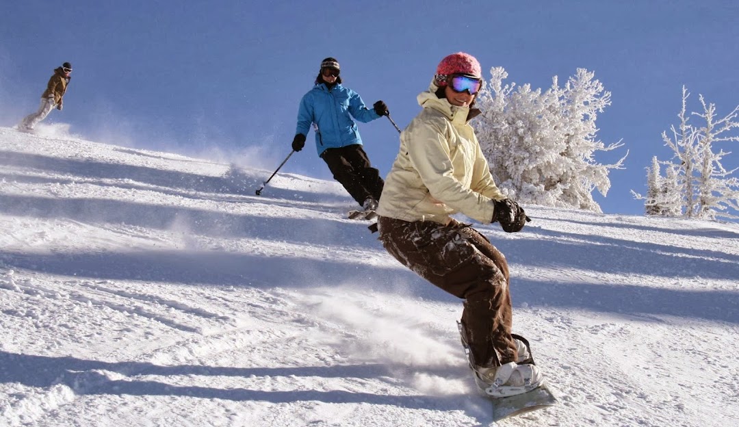 Brundage Mountain in USA - two people skiing down a snowy slope.