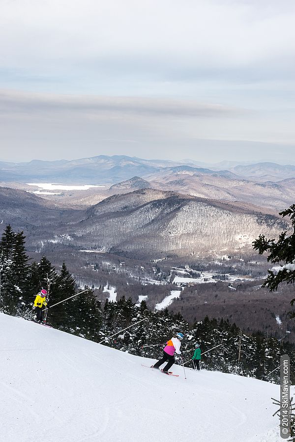 Pico Mountain in USA - a group of people skiing down a mountain.