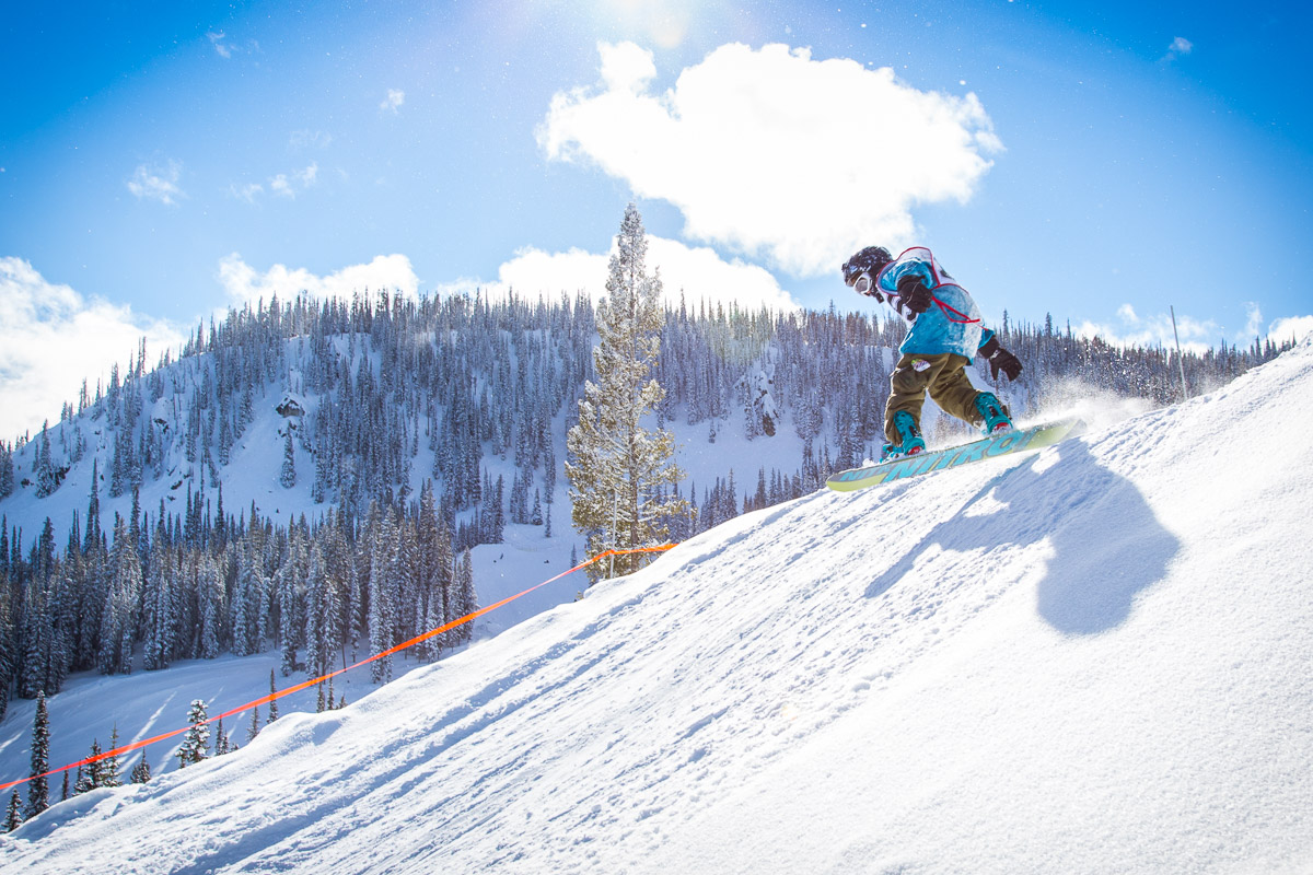 Lost Trail Powder Mountain in USA - a person on a snowboard going down a hill.