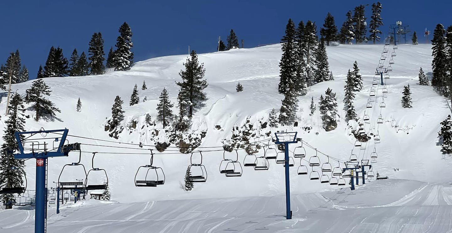 Donner Ski Ranch in USA - a ski lift going down a snowy slope.