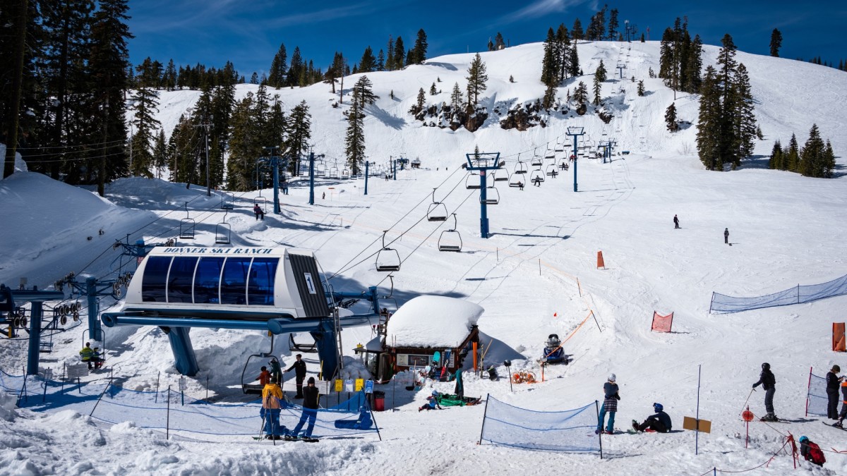 Donner Ski Ranch in USA - a group of people standing on top of a ski slope.