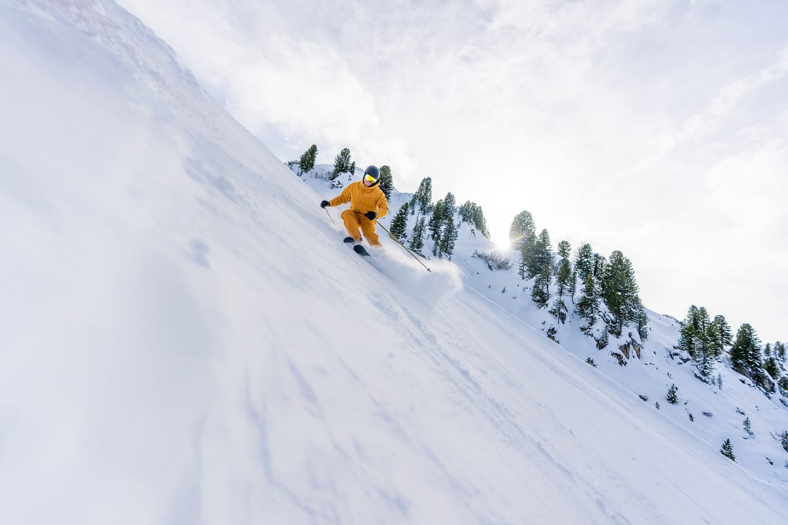 Mayrhofen Penken | Ahorn | Rastkogel | Eggalm in Austria - a snowboarder is going down a steep slope.