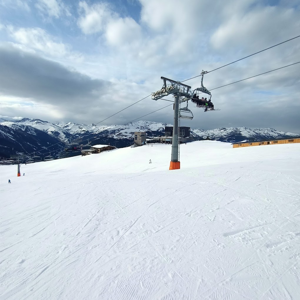 Mayrhofen Penken | Ahorn | Rastkogel | Eggalm in Austria - a ski slope with a ski lift in the background.