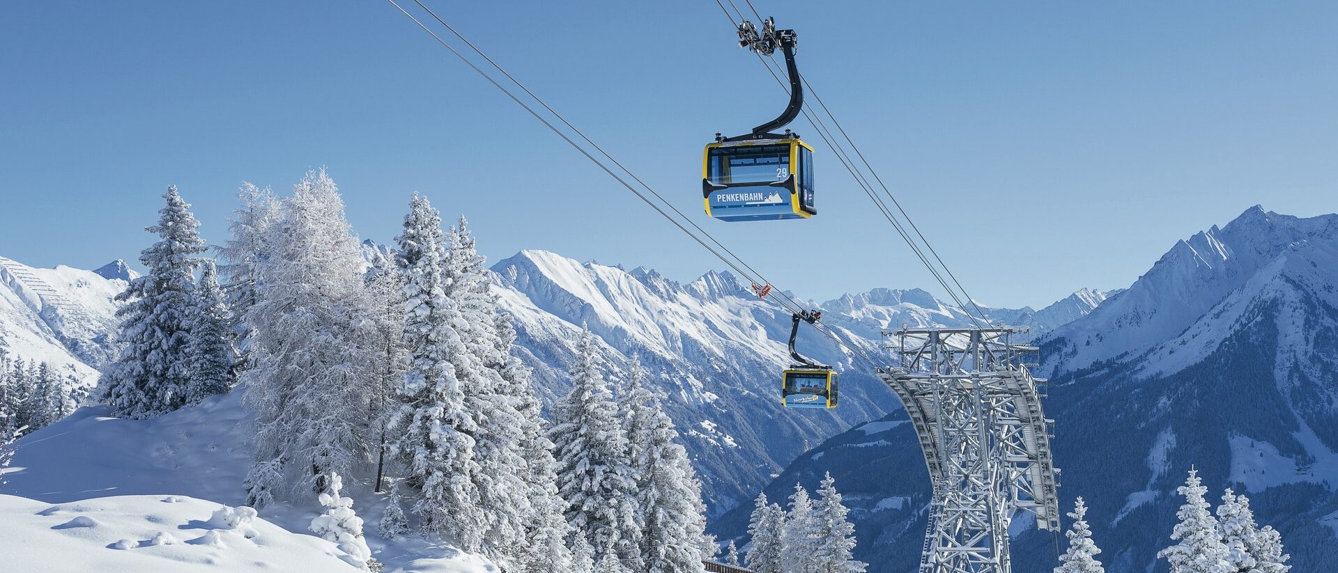 Mayrhofen Penken | Ahorn | Rastkogel | Eggalm in Austria - a ski lift going up a snowy mountain.