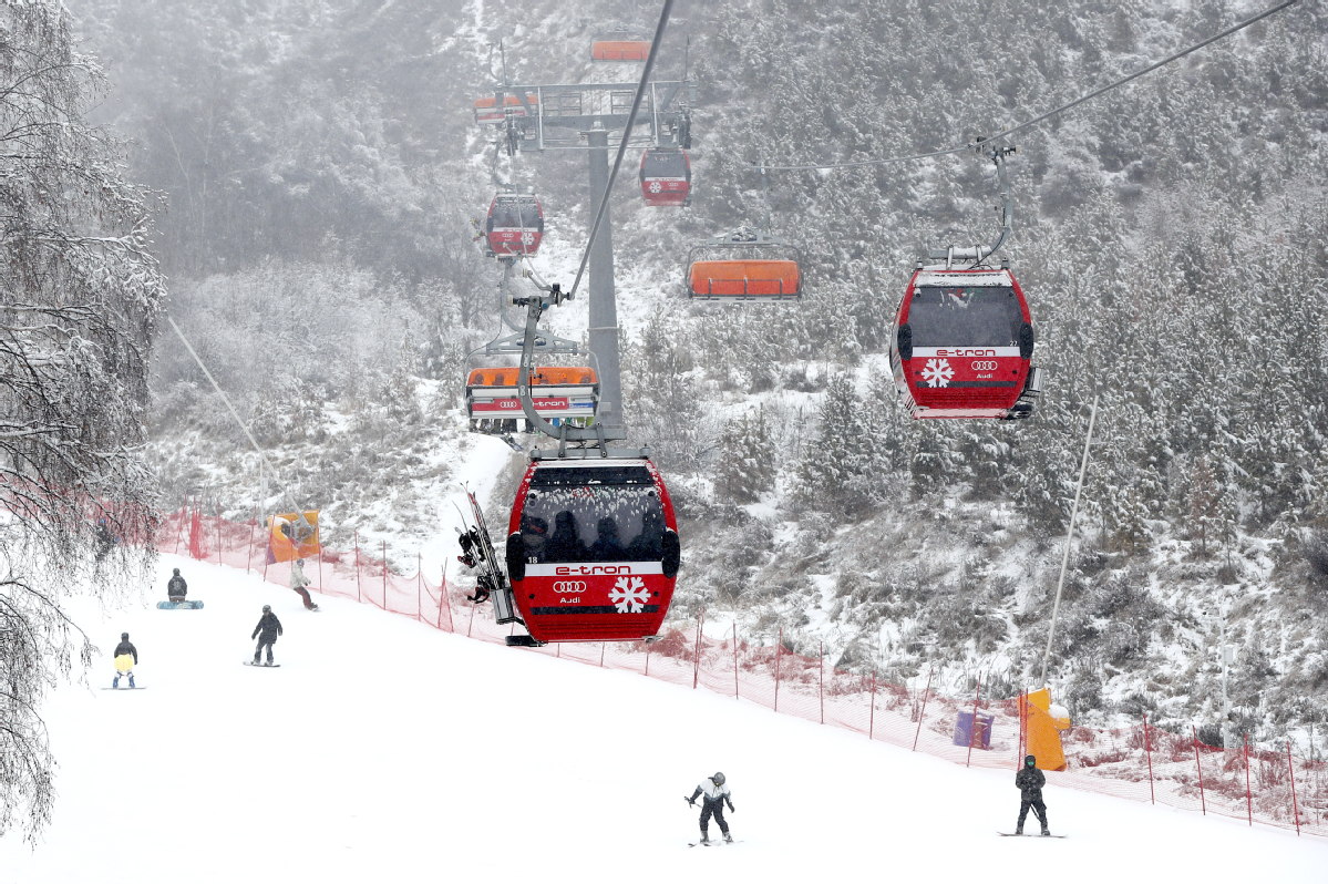 Genting Resort Secret Garden in China - a ski lift going up a snowy hill.