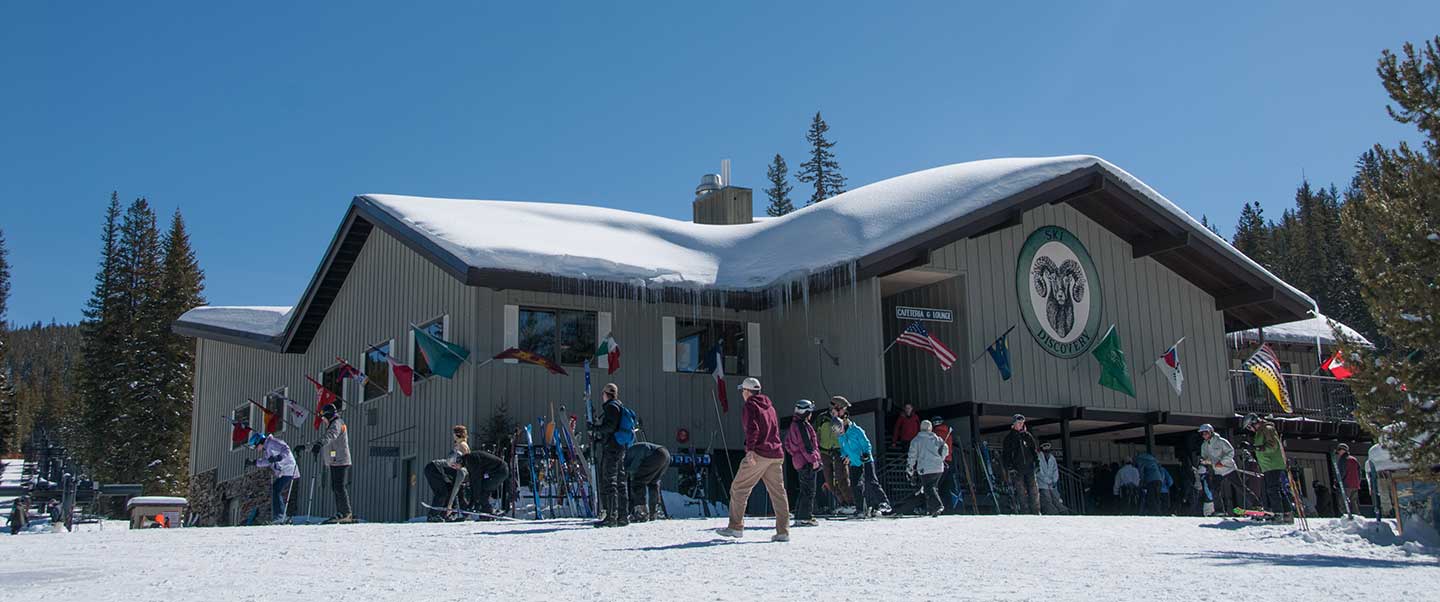 Discovery Ski Area in USA: snow on the roof of the building.
