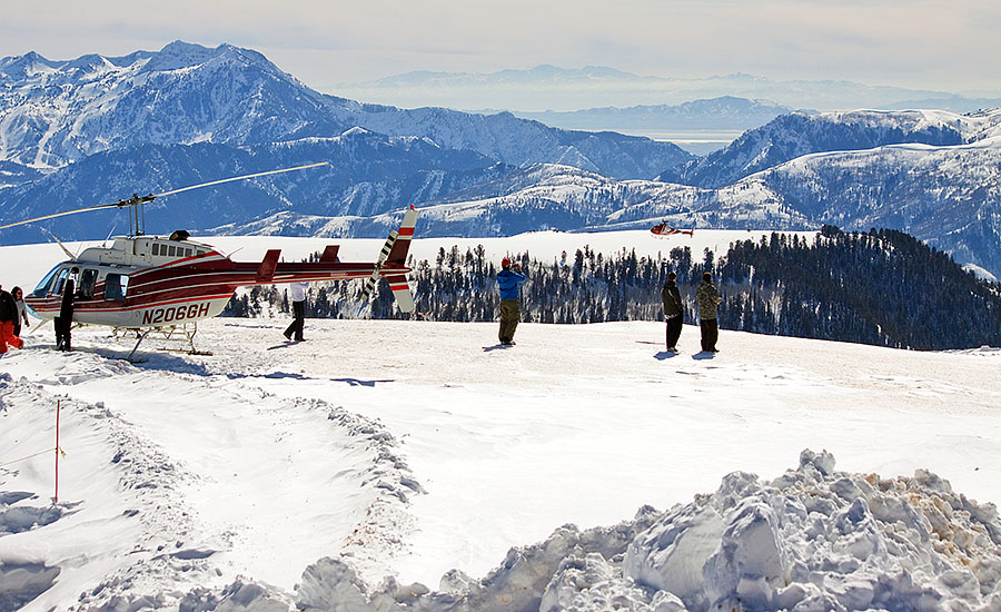 A winter sports scene at Diamond Peaks Utah showcasing a bustling ski resort amidst stunning snow-covered landscapes.