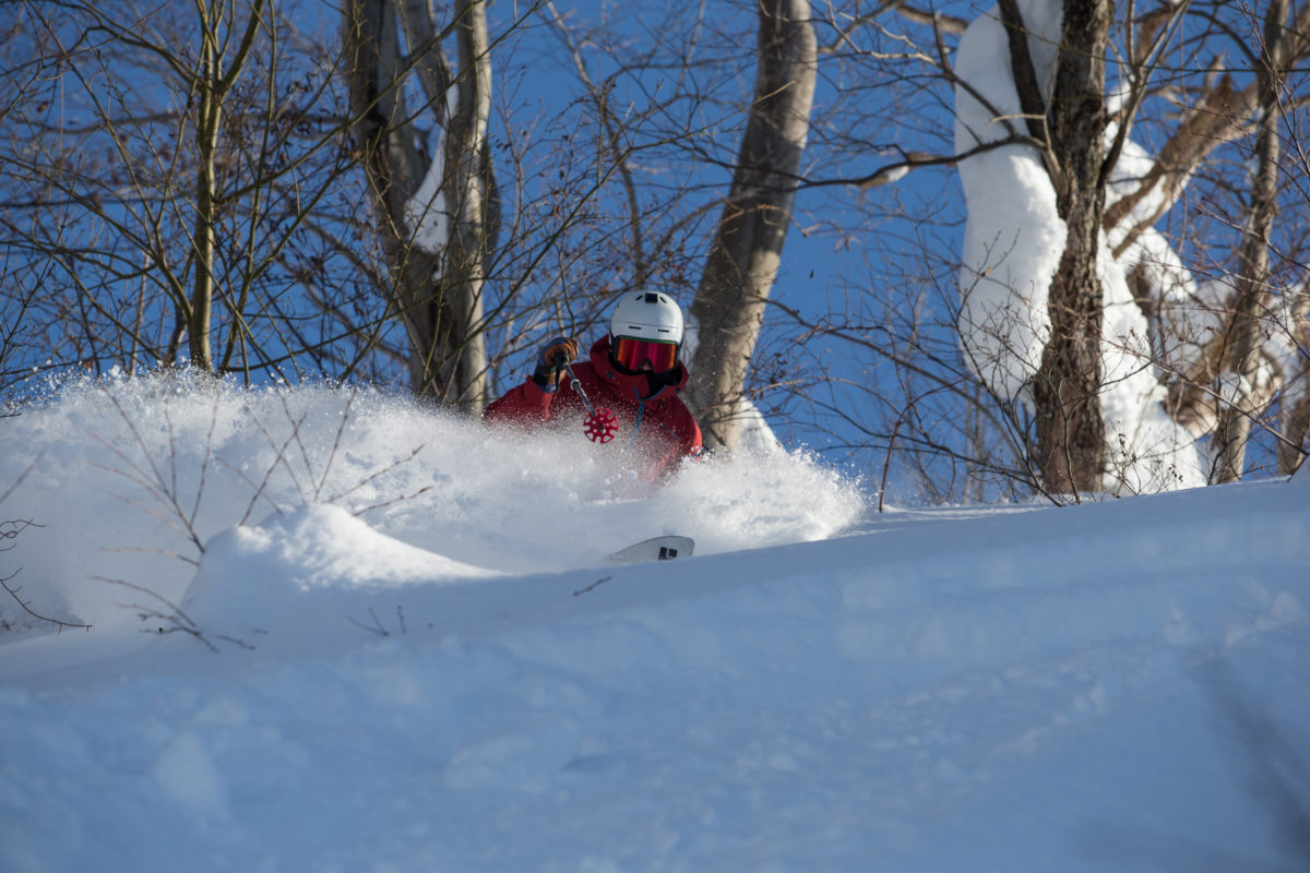 Yuzawa Kogen | ​Gala Yuzawa | ​​Ishiuchi Maruyama in Japan - a person riding a snowboard down a hill.