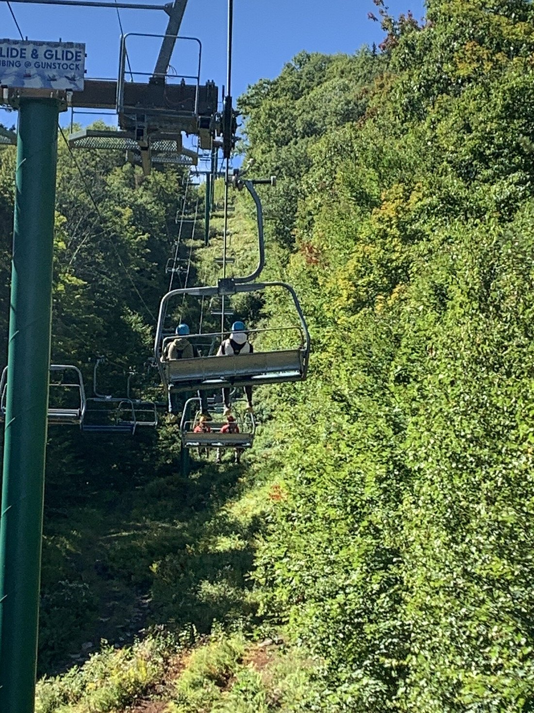 Gunstock Mountain Resort in USA - a view of a ski lift going up a hill.