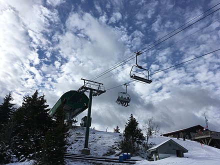 Gunstock Mountain Resort in USA - a ski lift going up the mountain.