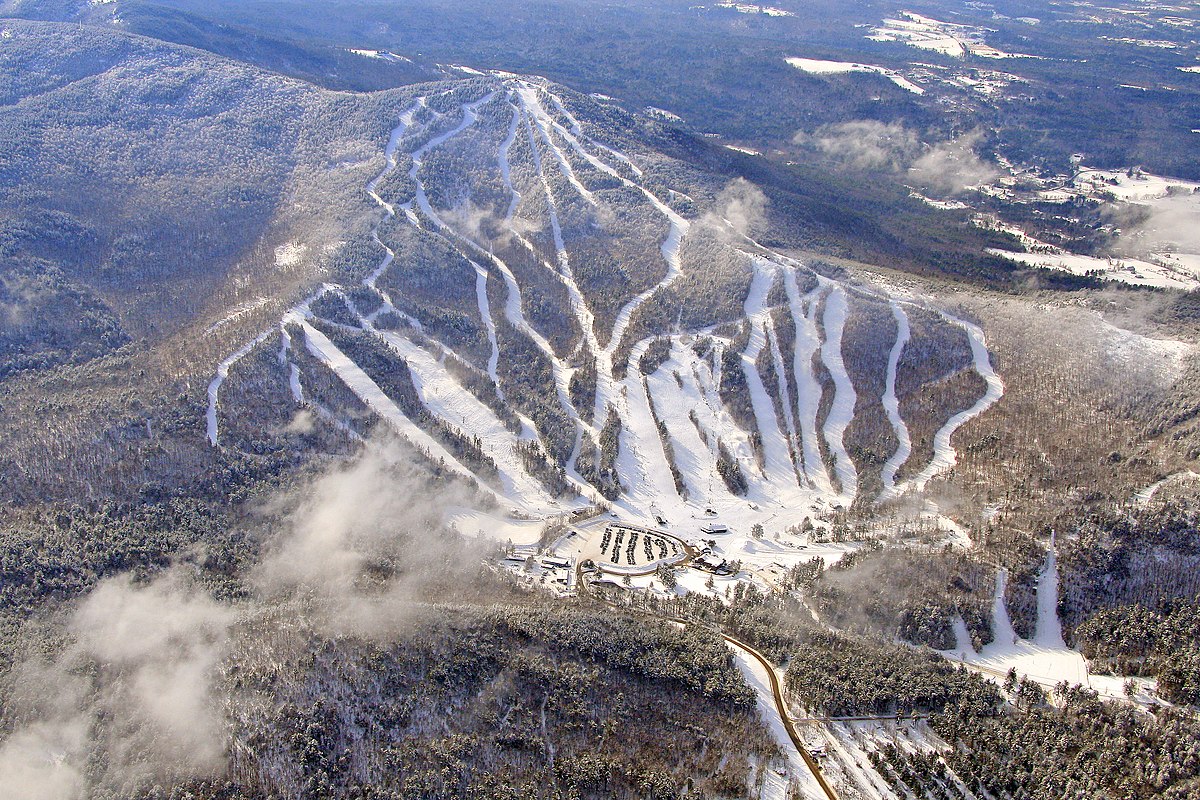 Gunstock Mountain Resort in USA: an aerial view of a ski resort in the mountains.