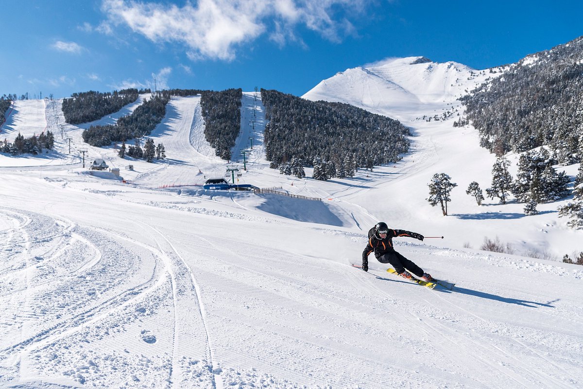 Espot Esqui in Spain - a person skiing down a snow covered slope.